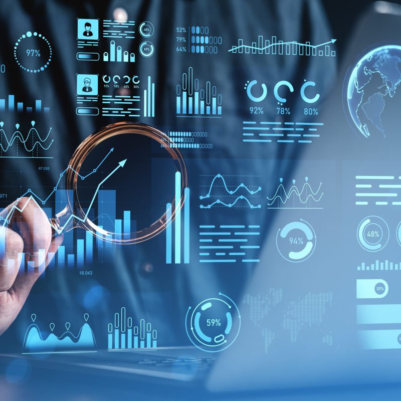 Businessman,Analyzing,Digital,Dashboard,With,Futuristic,Charts,And,Diagrams,On